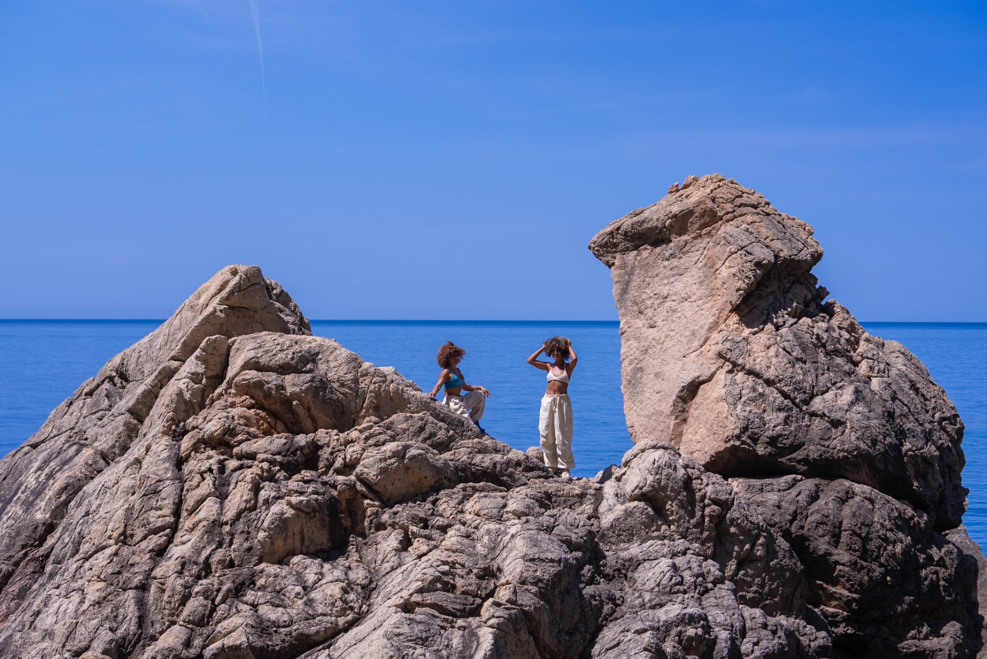 Another World, rocky shoreline and calm turquoise water