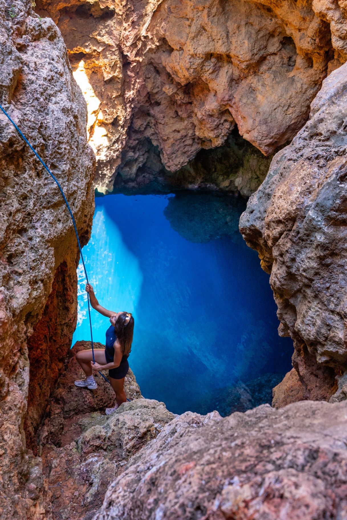 Alpine Express, rope climb above the glowing blue water