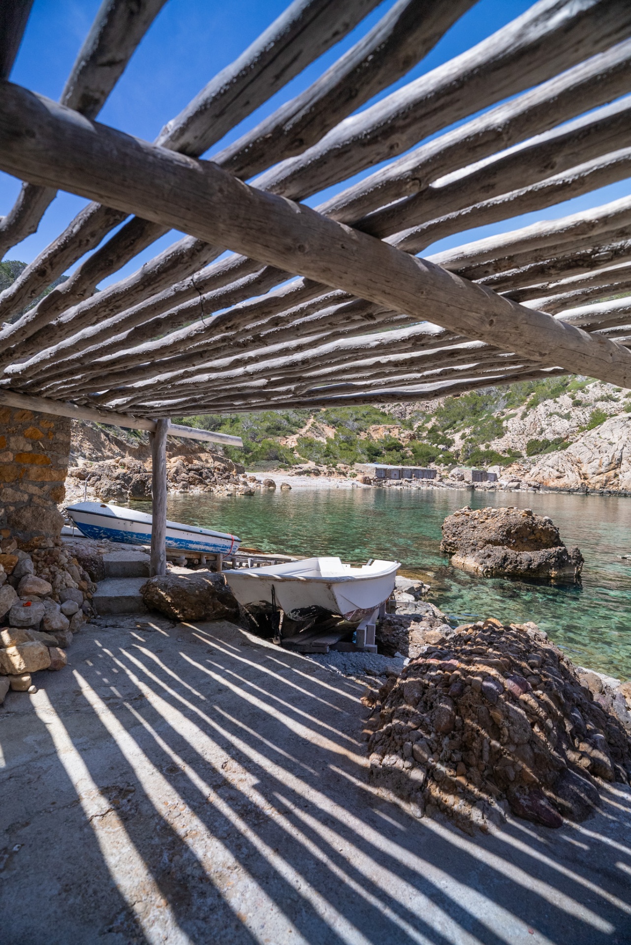 Laguna Love, timber shade structure and boats above the crystal water