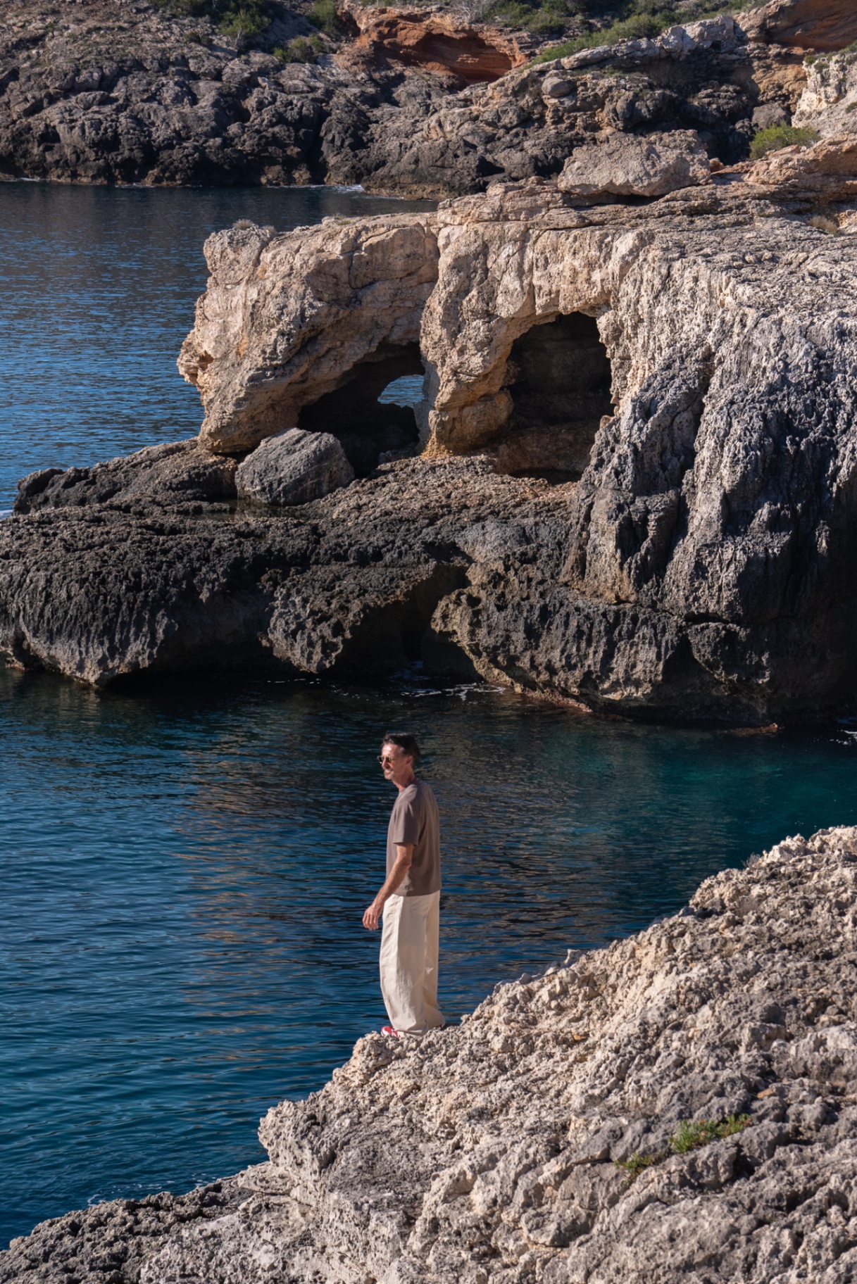 Lunar Dreams, hiker beside the turquoise inlet