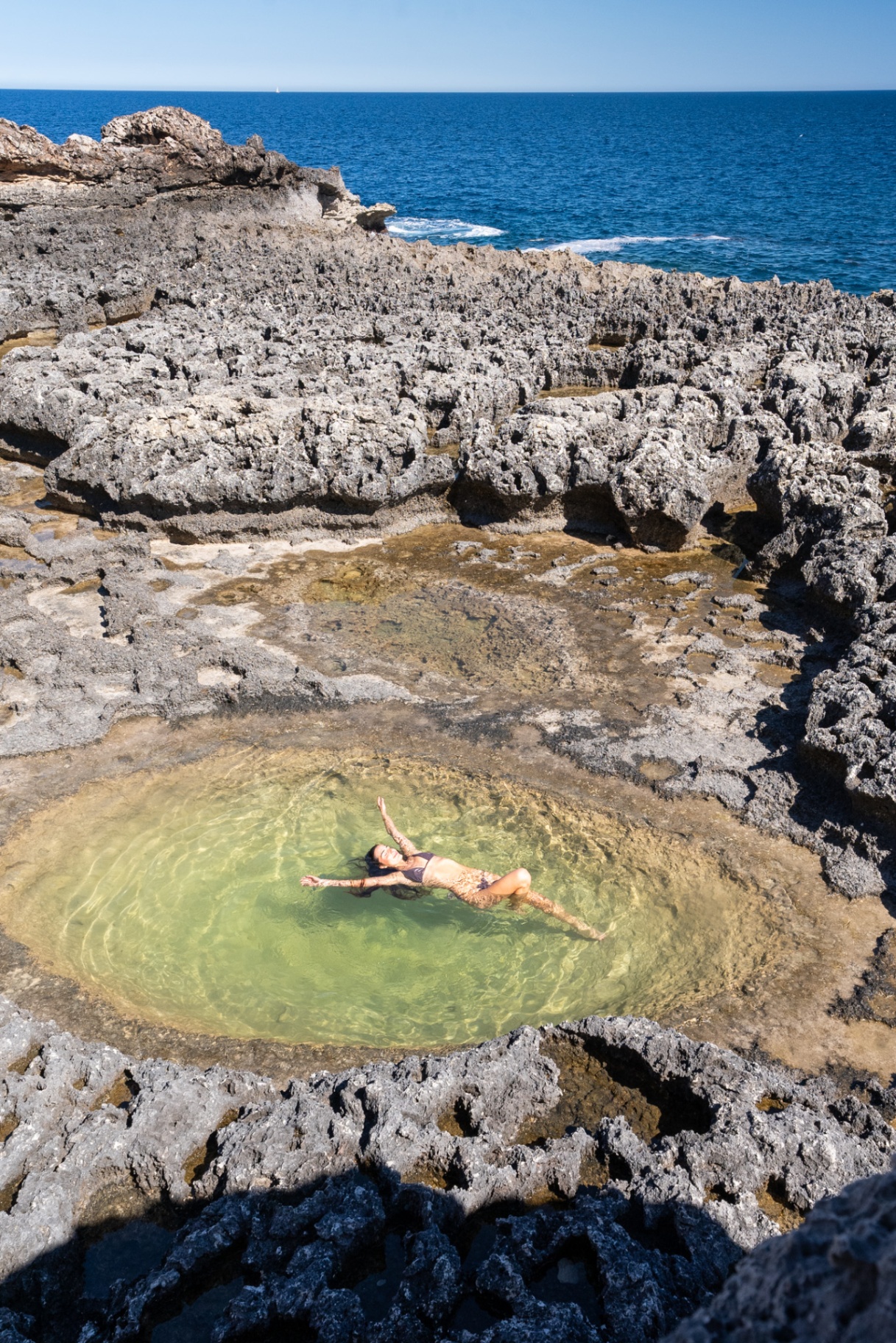 Lunar Dreams, floating in a natural rock pool by the sea