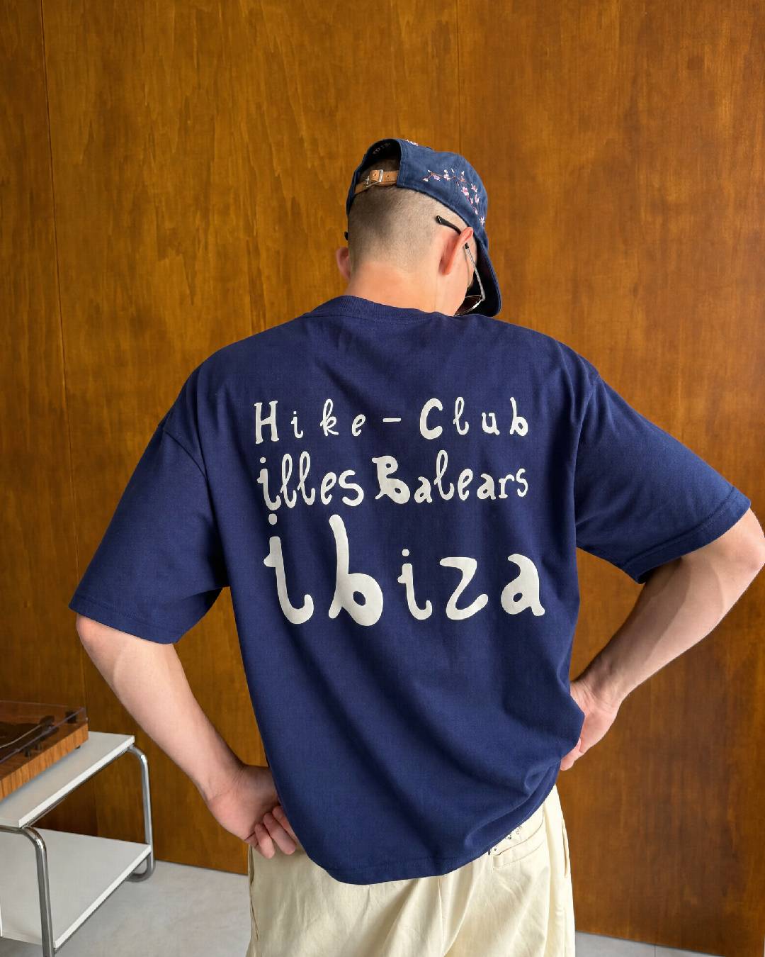 Man wearing the navy Hike Club Ibiza T-shirt