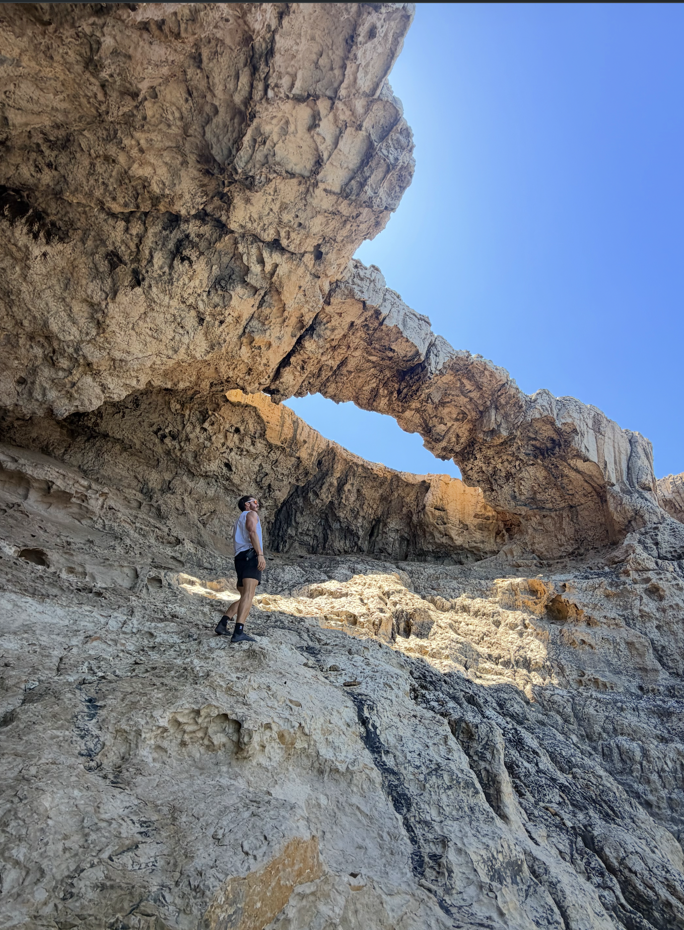 10. JURASSIC CAVE, selling fast hike on Ibiza (Moderate, 7 km). An ancient sea cave with a natural rock window.